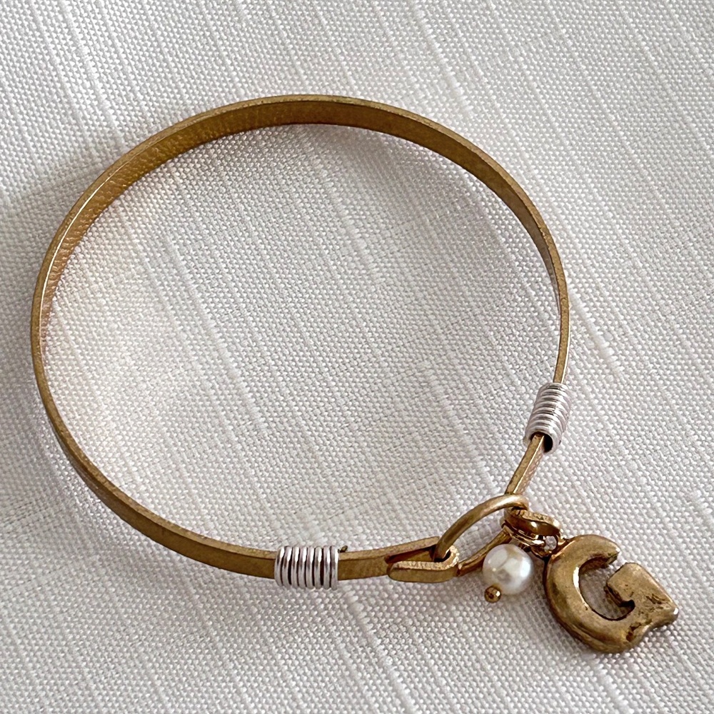 Gold Tone Bangle Hook Closure Bracelet 'G' Charm, and a Faux Pearl Bead Accent